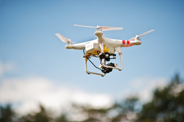 drone-quad-copter-with-high-resolution-digital-camera-flying-blue-sky